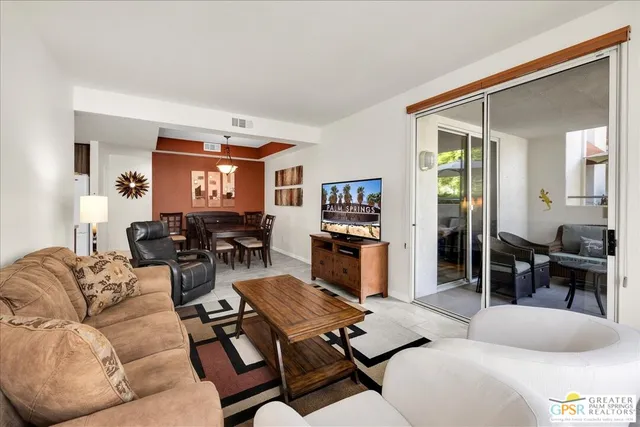 a living room with furniture and a window