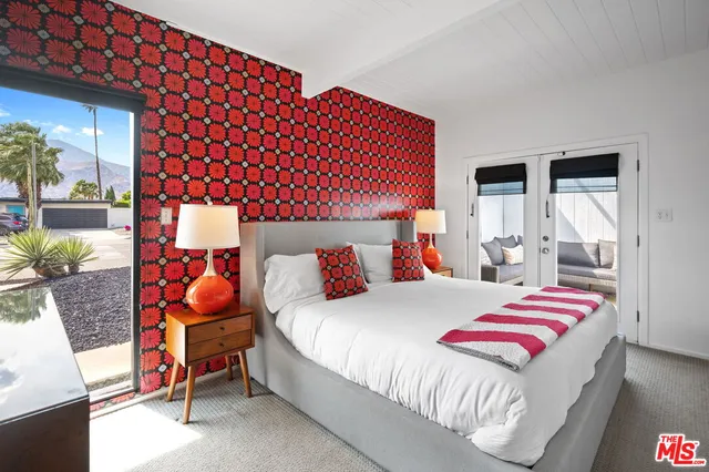 a bedroom with a bed and window