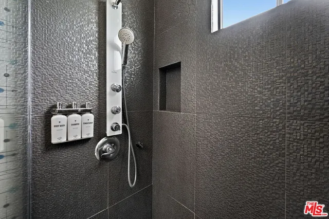 a bathroom with a sink and mirror