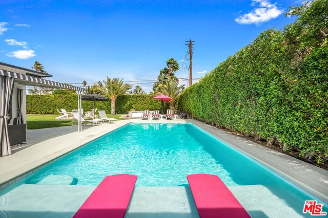 a view of swimming pool from a balcony