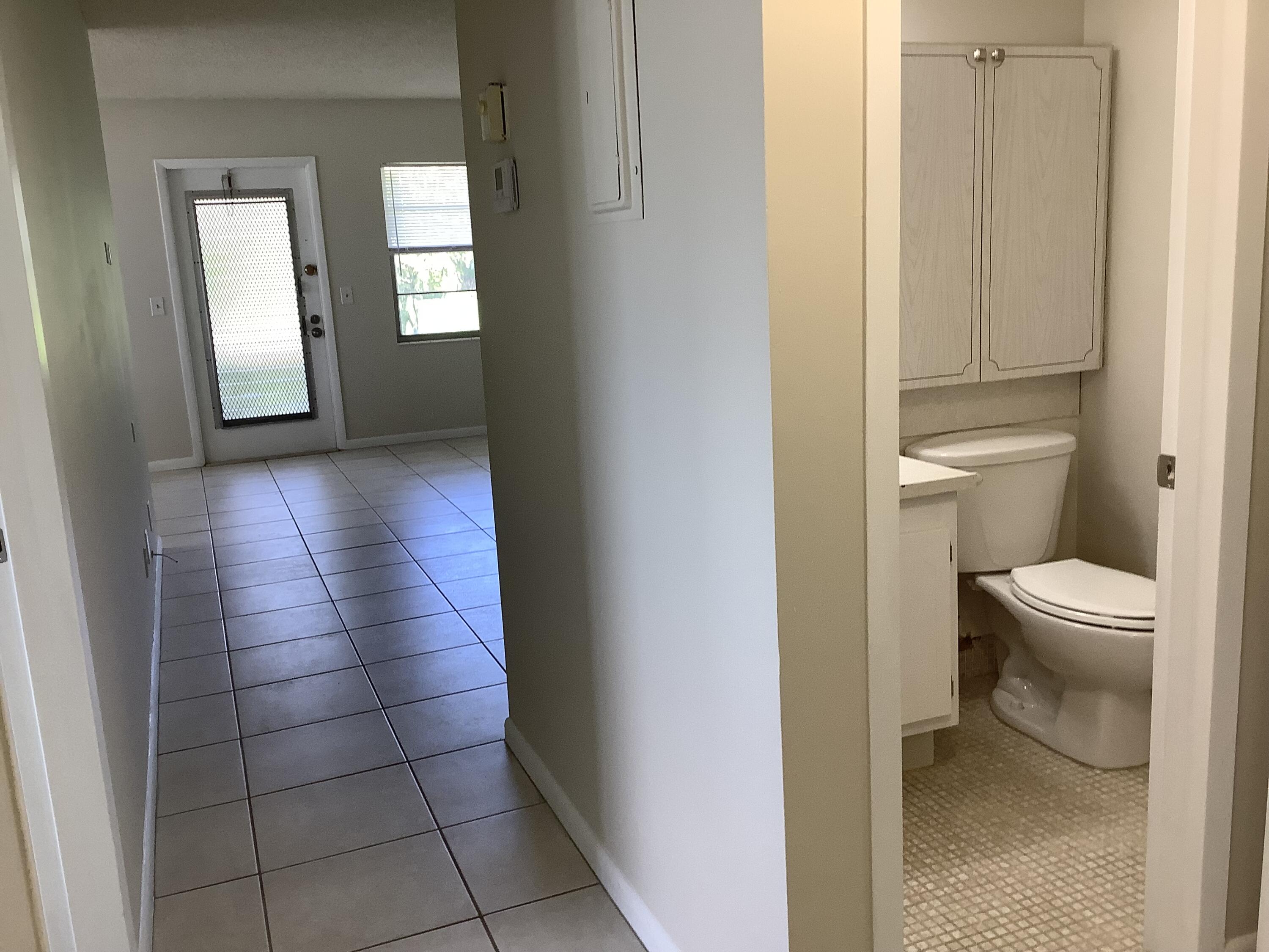 560 Fanshaw North, Unit 560 Boca Raton, FL 33434 - Photo 17 of 26 a bathroom with a toilet and a sink