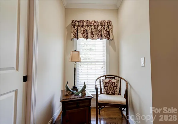 a view of a hallway with seating area