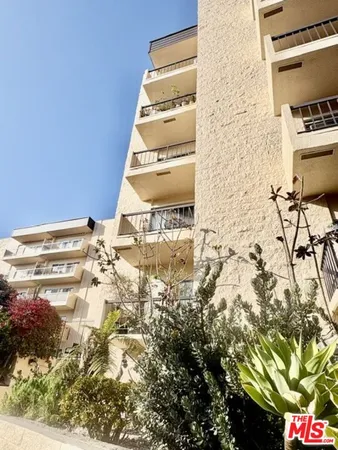 a view of balcony with wooden floor