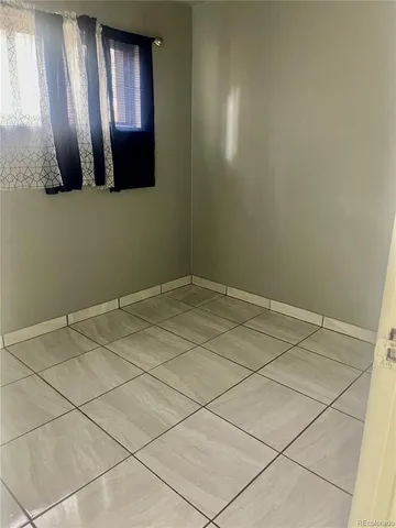 a view of a livingroom and window