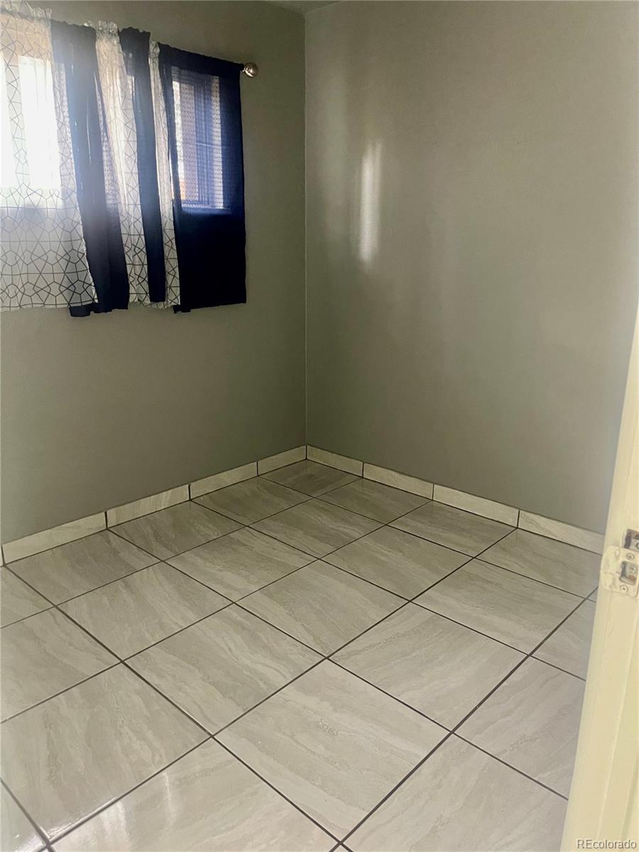 4332 West Nevada Place Denver, CO 80219 - Photo 13 of 14 a view of a livingroom and window