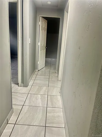 a bathroom with a toilet sink and shower