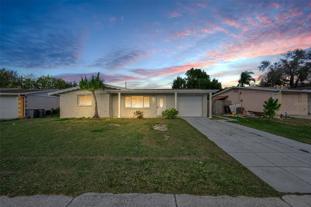 front view of a house with a yard