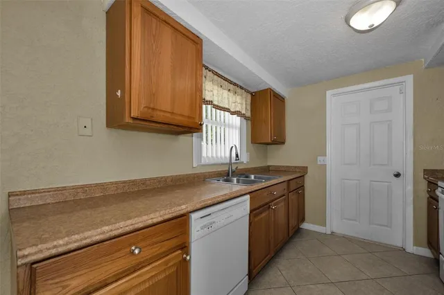 a kitchen with a sink and a stove