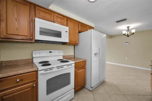 a kitchen with a stove and a microwave