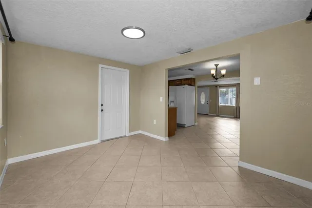 a view of an empty room with a fireplace