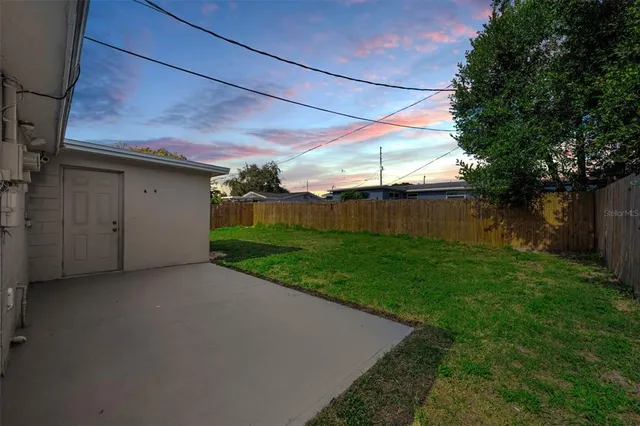a backyard of a house with lots of green space