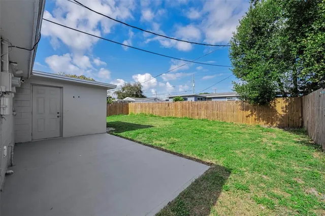 a view of a back yard of the house