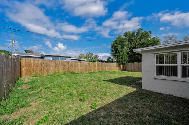 a view of backyard with green space
