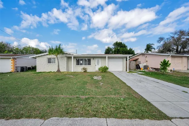 front view of a house with a yard