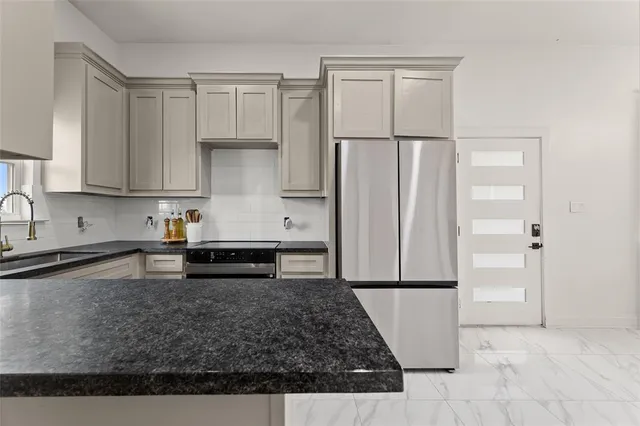 a view of a livingroom with wooden floor and furniture