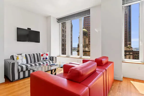 a living room with furniture and a flat screen tv