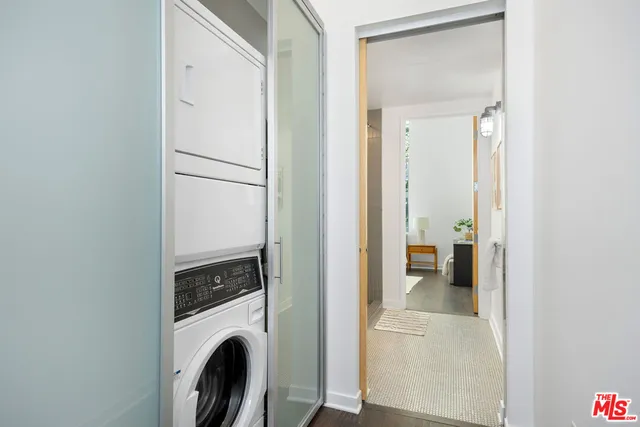 a view of a hallway with washer and dryer