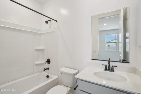 an empty room with a empty space and windows