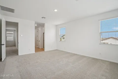 a spacious bathroom with a shower sink and mirror