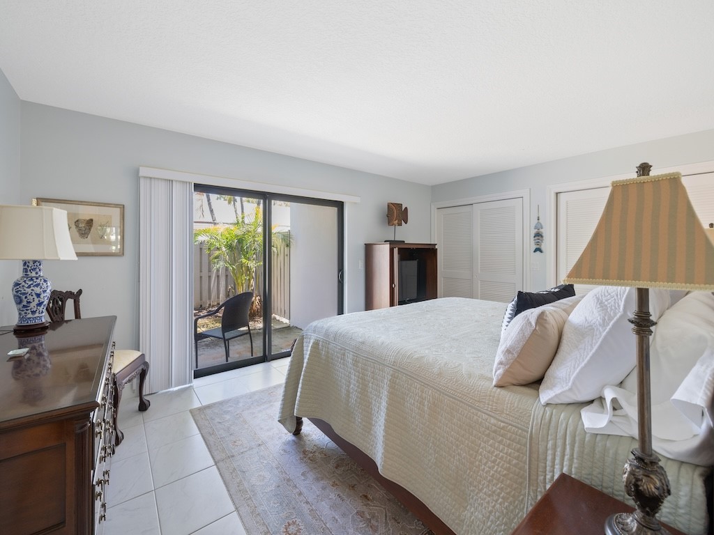 1155 Reef Road, Unit B7 Vero Beach, FL 32963 - Photo 15 of 31 a bed room with a bed and a window