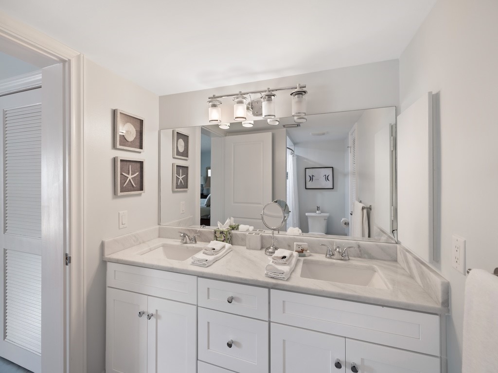 1155 Reef Road, Unit B7 Vero Beach, FL 32963 - Photo 17 of 31 a bathroom with a sink double vanity and a mirror
