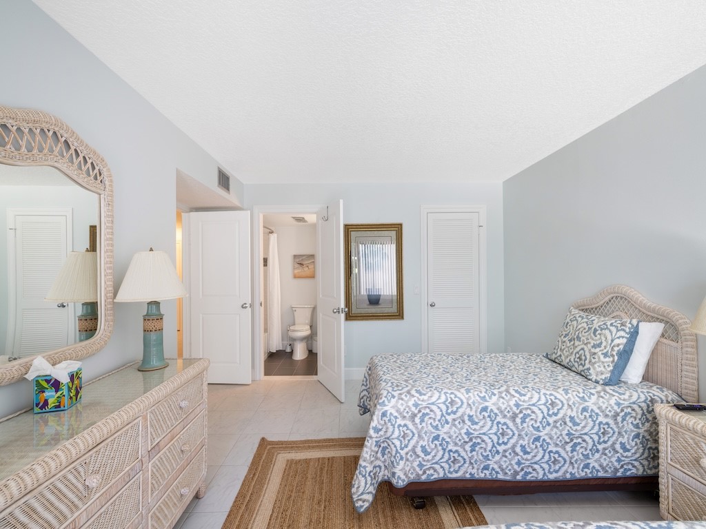 1155 Reef Road, Unit B7 Vero Beach, FL 32963 - Photo 21 of 31 a bedroom with a bed and a couch