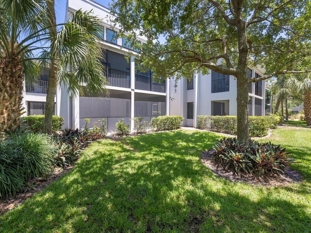 1155 Reef Road, Unit B7 Vero Beach, FL 32963 - Photo 27 of 31 a view of a house with a tree and plants