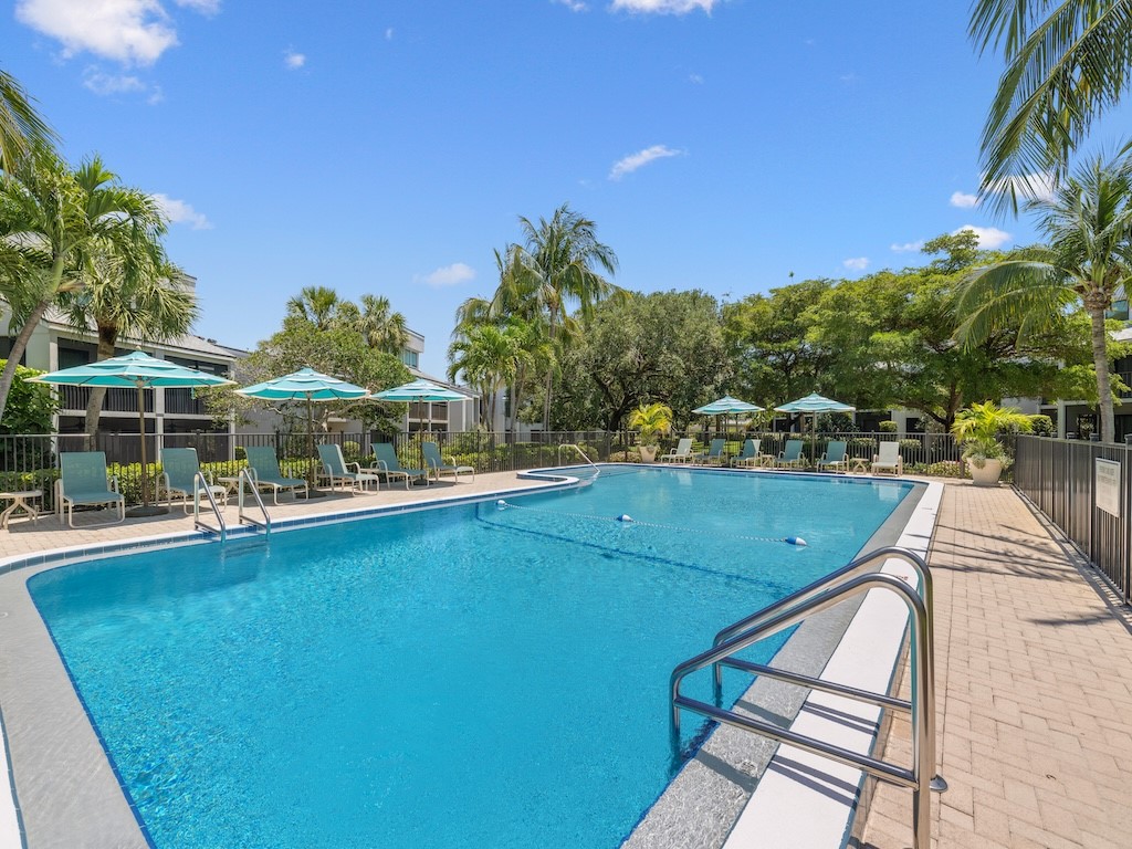 1155 Reef Road, Unit B7 Vero Beach, FL 32963 - Photo 4 of 31 a view of a swimming pool with seating area and furniture