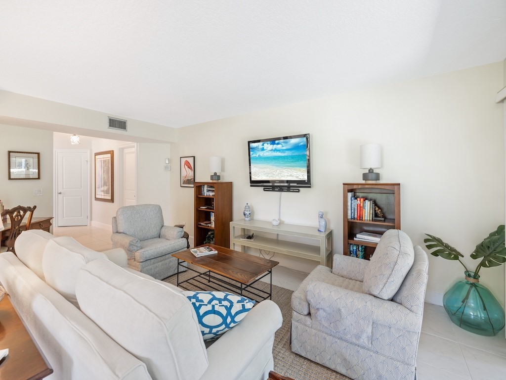 1155 Reef Road, Unit B7 Vero Beach, FL 32963 - Photo 9 of 31 a living room with furniture and a flat screen tv