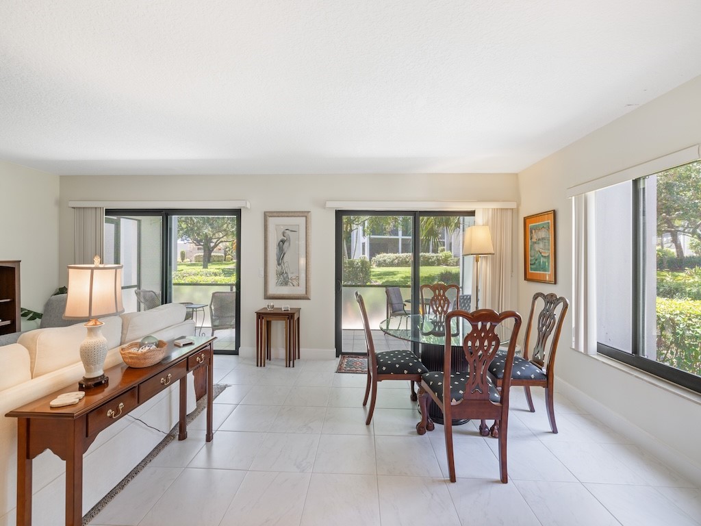 1155 Reef Road, Unit B7 Vero Beach, FL 32963 - Photo 10 of 31 a living room with furniture and large windows