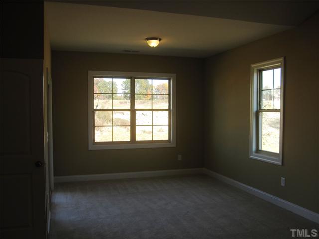 7639 Birchmoor Way, Unit LT91 Raleigh, NC 27616 - Photo 14 of 15 an empty room with a window