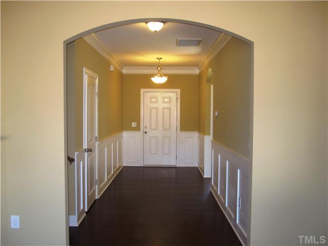 7639 Birchmoor Way, Unit LT91 Raleigh, NC 27616 - Photo 5 of 15 a view of a hallway with wooden floor and entryway