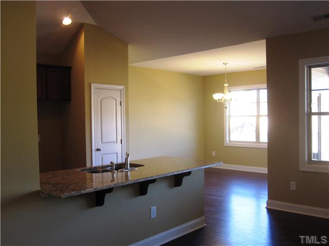 7639 Birchmoor Way, Unit LT91 Raleigh, NC 27616 - Photo 10 of 15 a view of a room with wooden floor and window