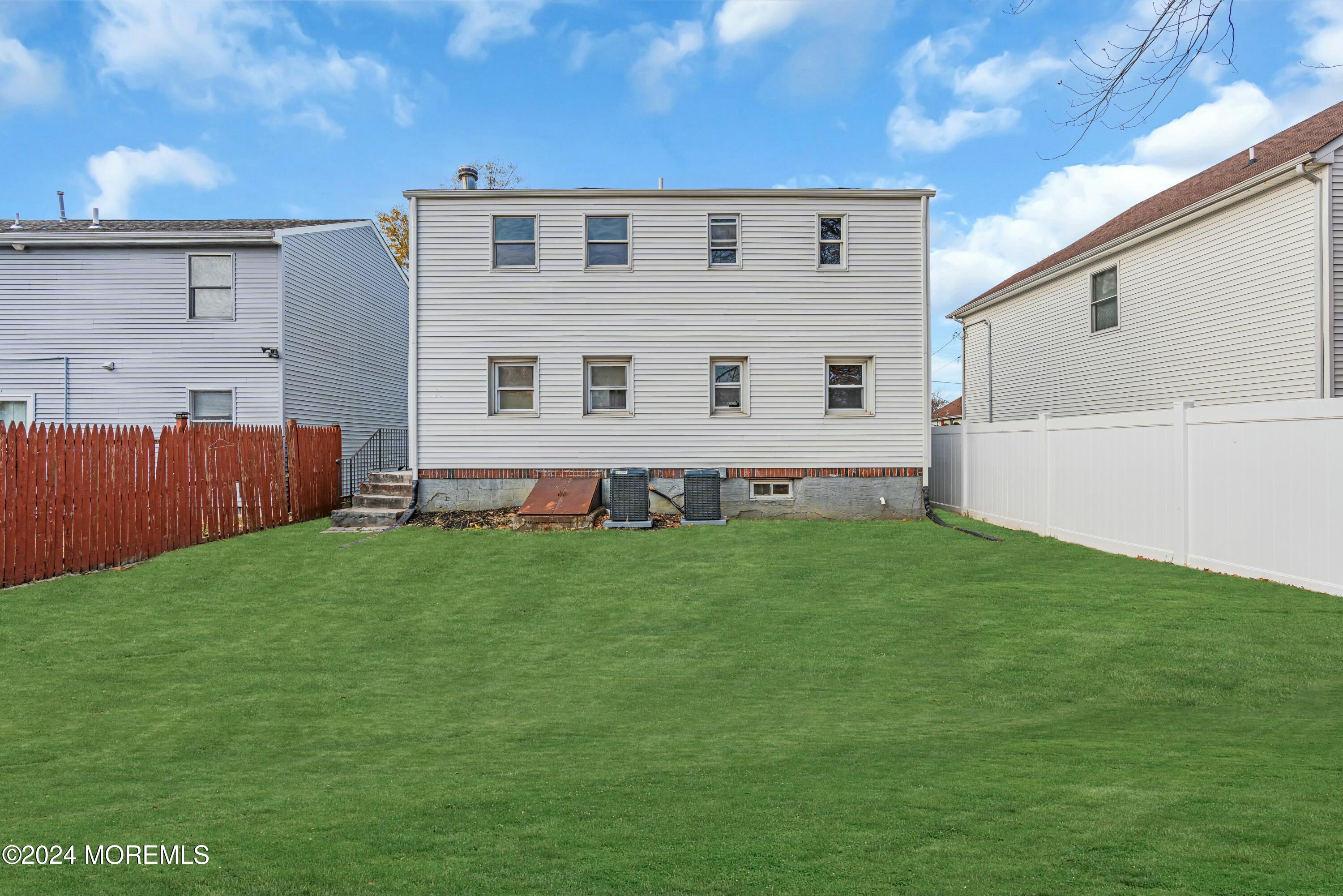 211 Delaware Avenue, Unit 2 Cliffwood, NJ 07721 - Photo 15 of 16 a front view of house with yard