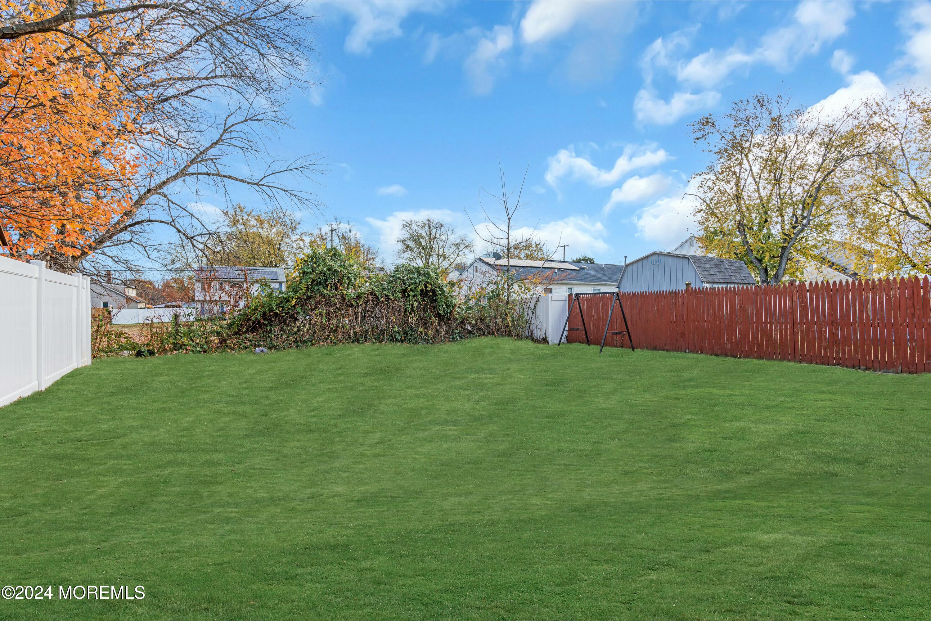 211 Delaware Avenue, Unit 2 Cliffwood, NJ 07721 - Photo 16 of 16 a view of garden with tree in the background