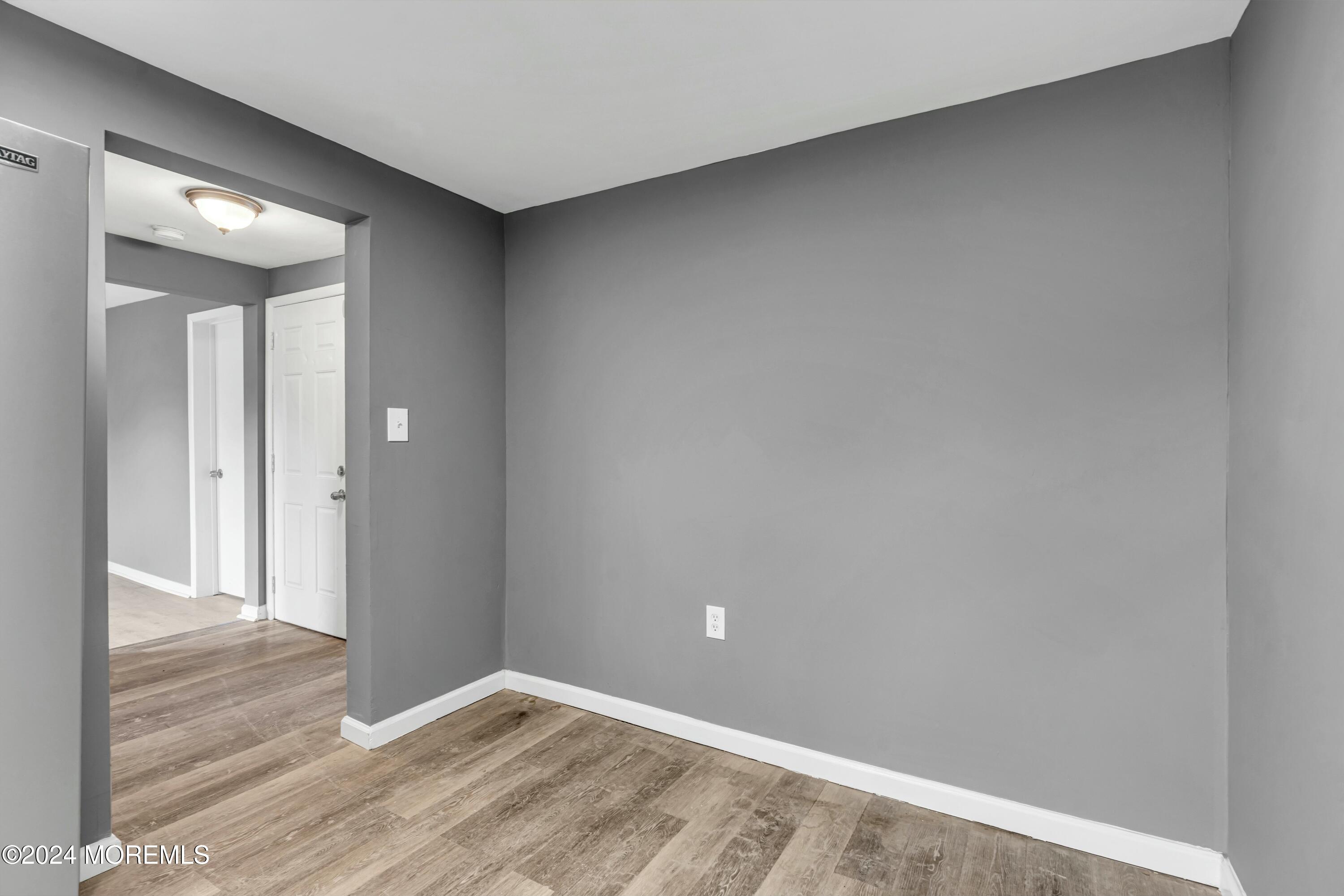 211 Delaware Avenue, Unit 2 Cliffwood, NJ 07721 - Photo 8 of 16 wooden floor in a hall with an entryway