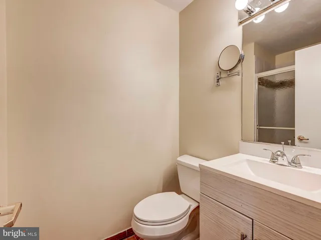a bathroom with a window and a shower
