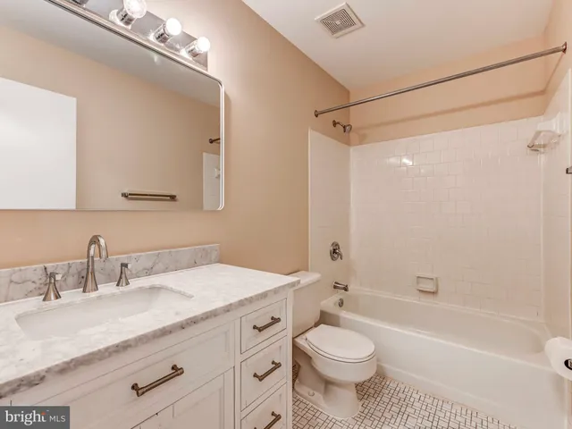 a view of staircase with wooden floor and white walls