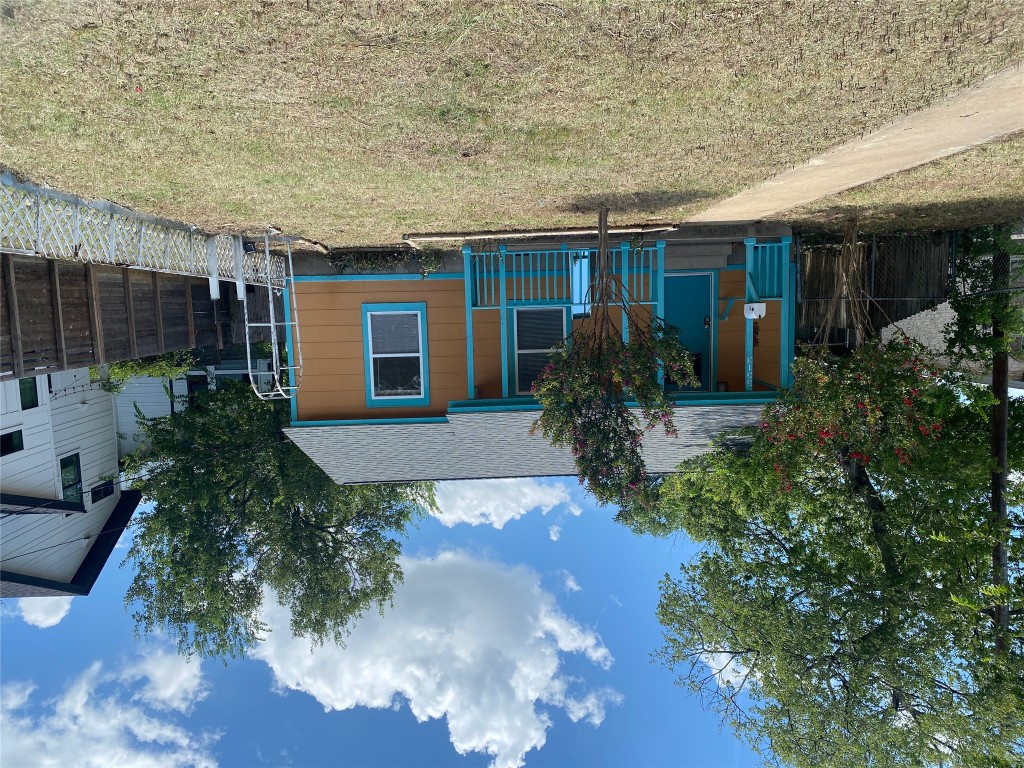 5513 Woodrow Avenue Austin, TX 78756 - Photo 3 of 17 a view of house with backyard and trees