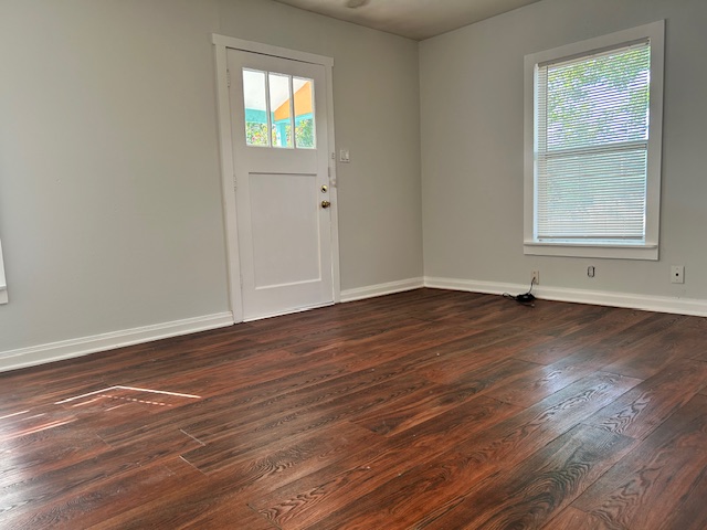 5513 Woodrow Avenue Austin, TX 78756 - Photo 7 of 17 an empty room with wooden floor and windows
