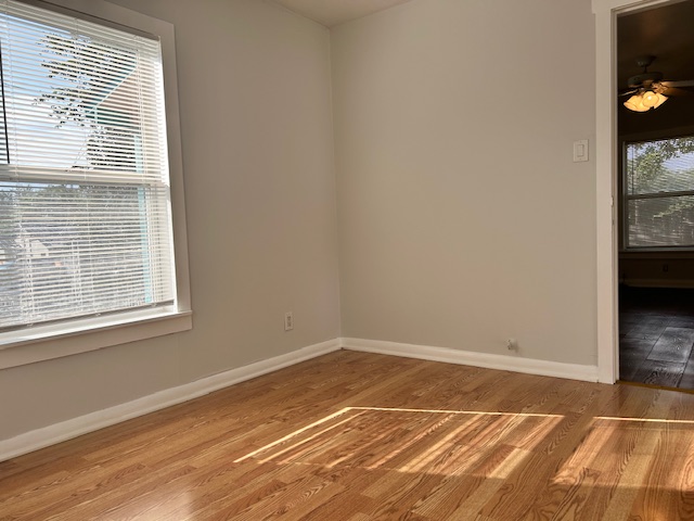 5513 Woodrow Avenue Austin, TX 78756 - Photo 9 of 17 a view of a room with wooden floor and a window