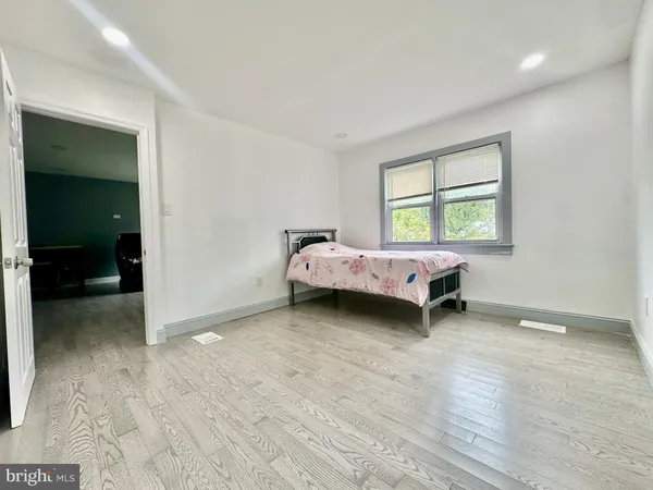 a bed room with a bed and a window
