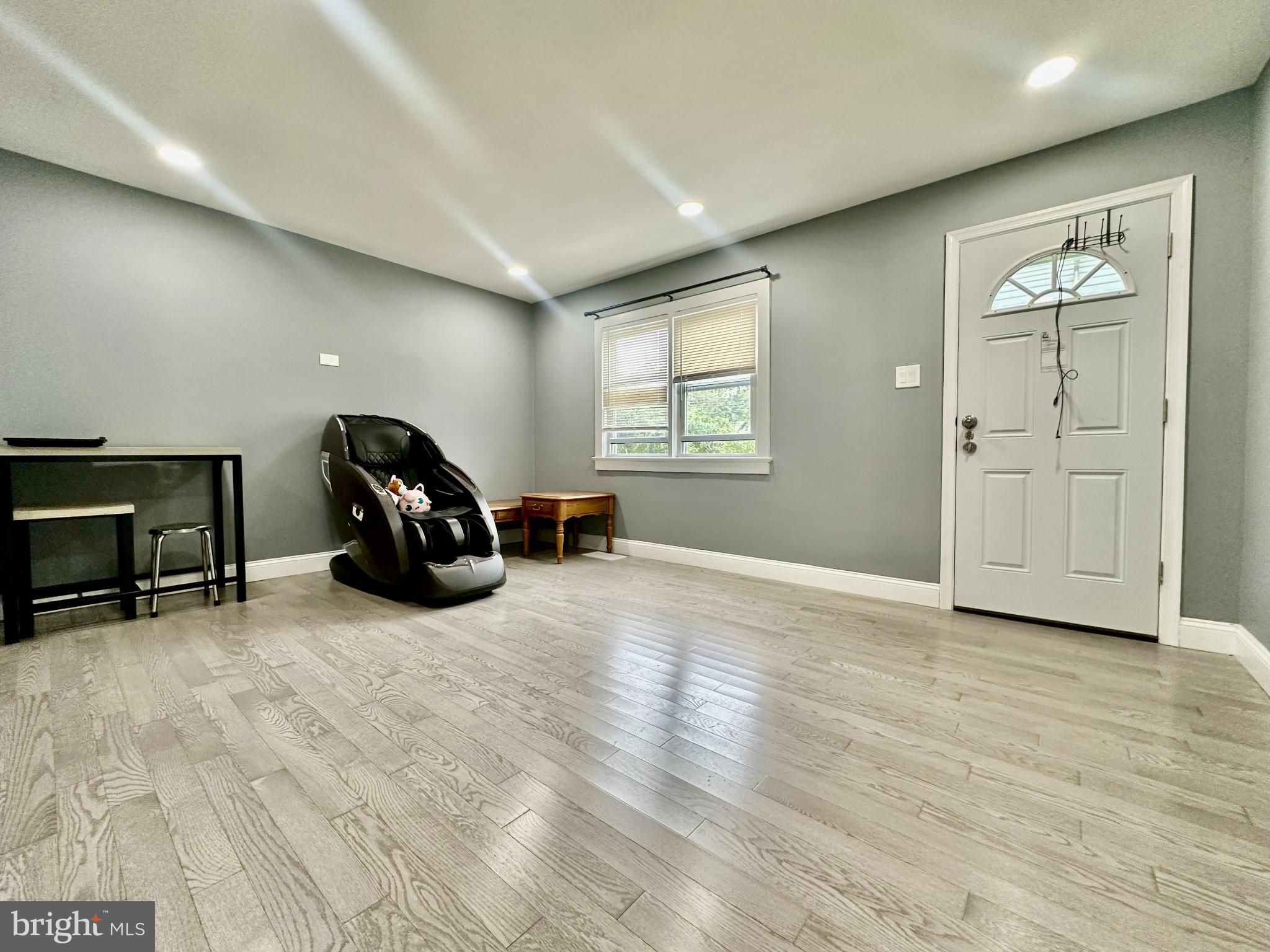 633 Durham Road Newtown, PA 18940 - Photo 2 of 31 a view of a livingroom with a car and wooden floor