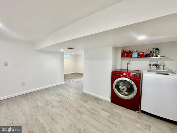 a view of a storage & utility room with washer and dryer