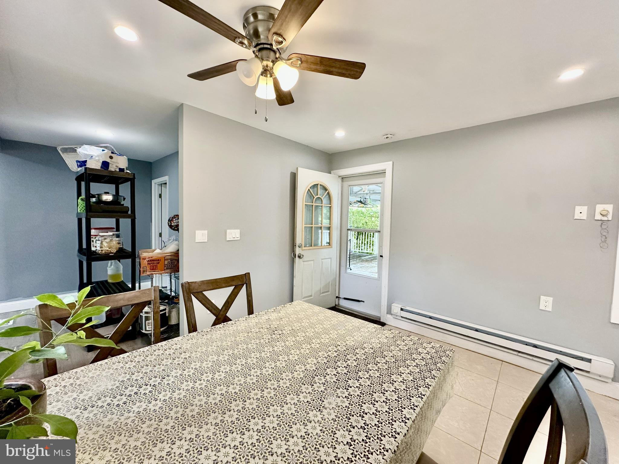 633 Durham Road Newtown, PA 18940 - Photo 10 of 31 a bedroom with a bed and a chandelier
