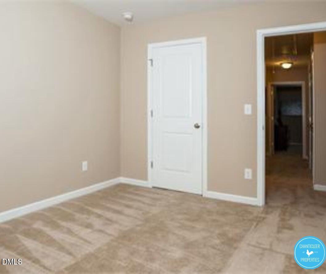3559 Aldie Court Raleigh, NC 27610 - Photo 5 of 11 an empty room with closet and mirror
