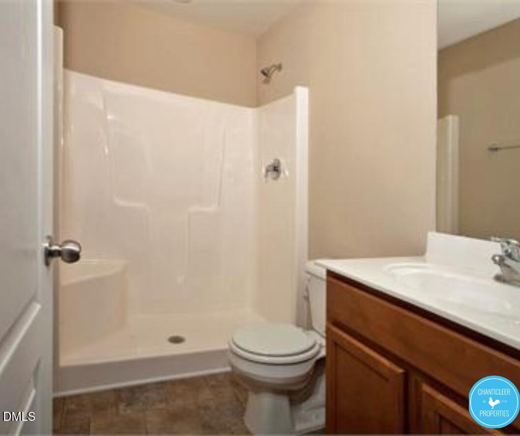 3559 Aldie Court Raleigh, NC 27610 - Photo 6 of 11 a bathroom with a sink a toilet and shower