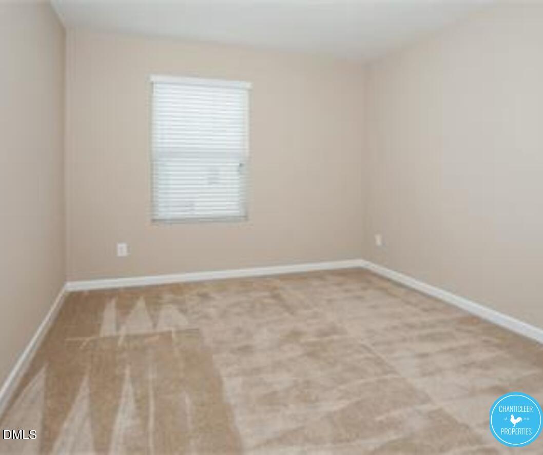 3559 Aldie Court Raleigh, NC 27610 - Photo 7 of 11 an empty room with a window