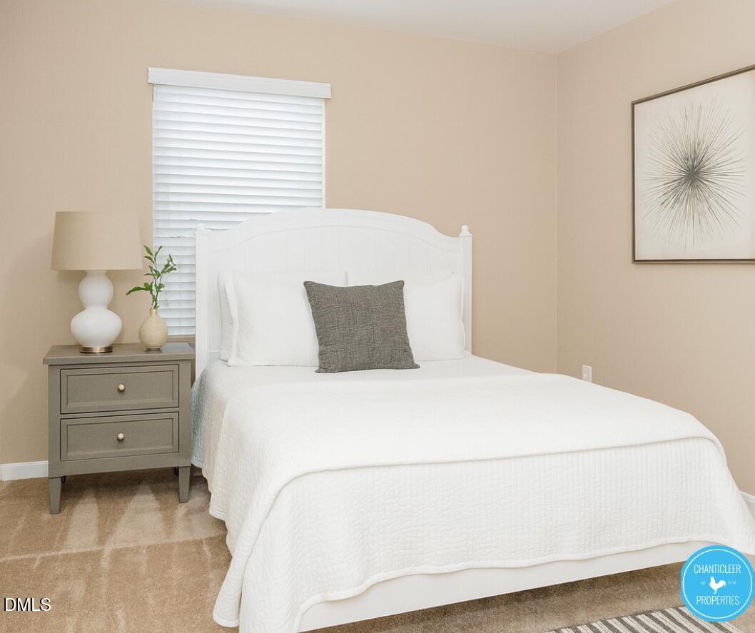 3559 Aldie Court Raleigh, NC 27610 - Photo 8 of 11 a bedroom with a bed and a window