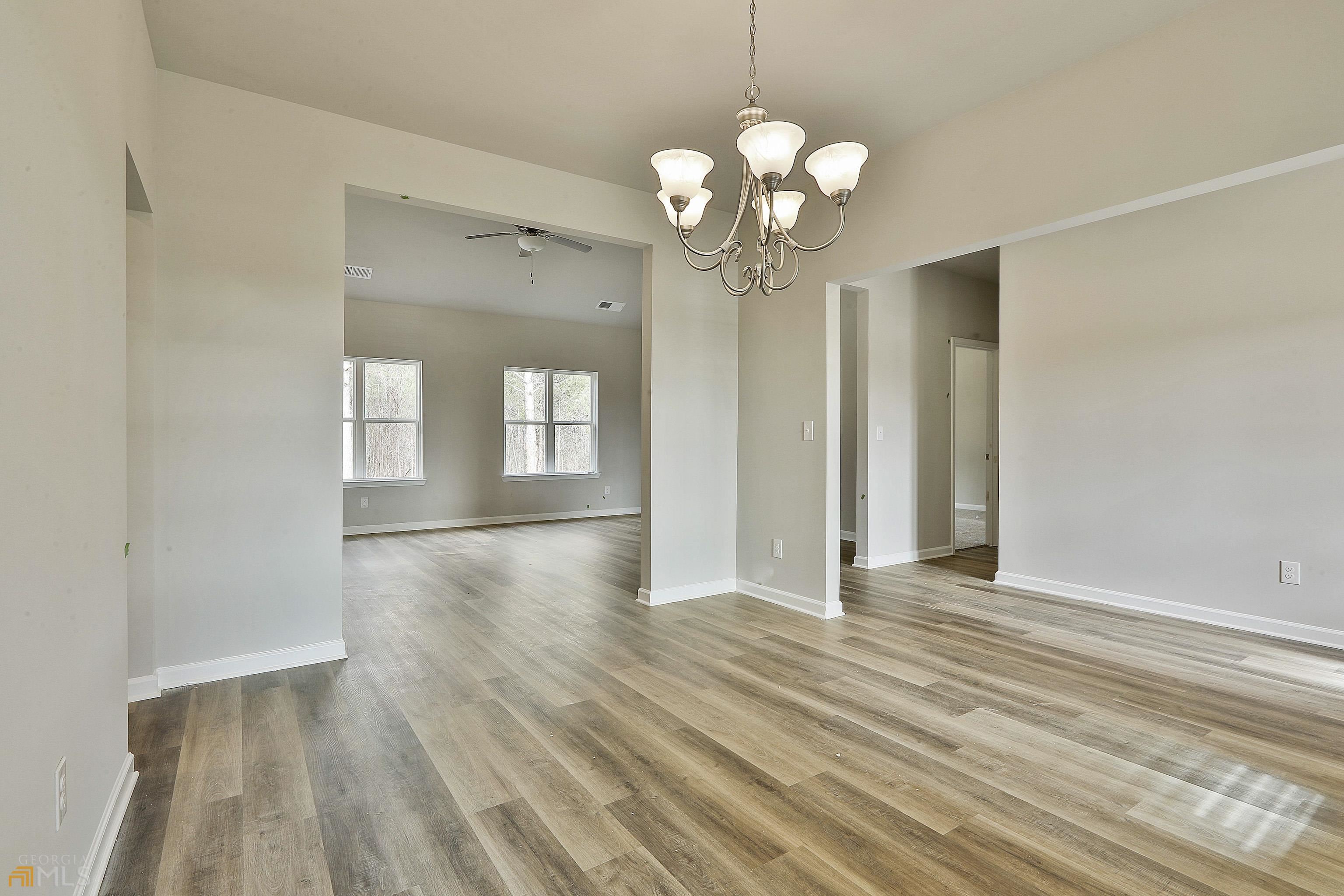 3575 Strickland Town Road Luthersville, GA 30251 - Photo 13 of 29 a view of an empty room with wooden floor and a window